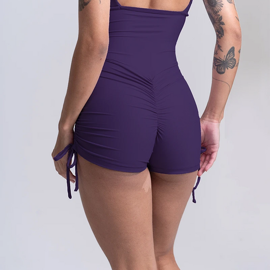 Macaquinho Fitness New Pérola Violeta Maré Maria – frente com alças reguláveis e pala na cintura