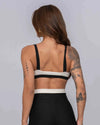 Top Fitness Flow Duo Off White com Super Black - Maré Maria moda fitness