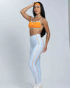 Top Fitness New Front Bicolor Tangerina viés Azul Ice