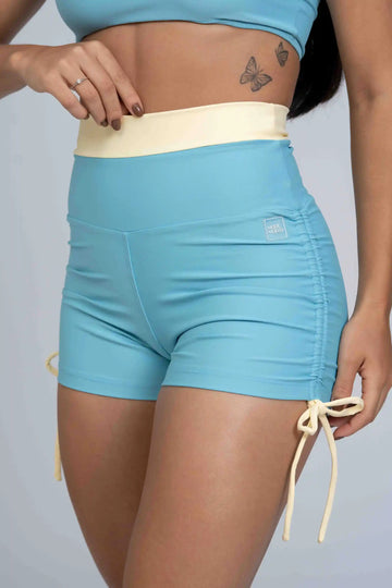 Short Smile Duo Azul céu e Amarelo Brisa c/ empina (Leve Defeito)